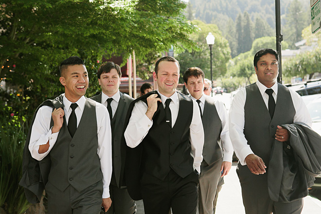 Groom and groomsmen walking to wedding in downtown Mill Valley