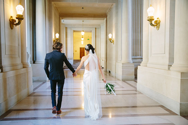 San Francisco City Hall wedding, Bride and groom walking to their ceremony