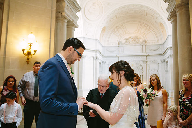 San Francisco wedding
photographer, bride and groom saying their vows in the Rotunda during their San Francisco City Hall wedding ceremony