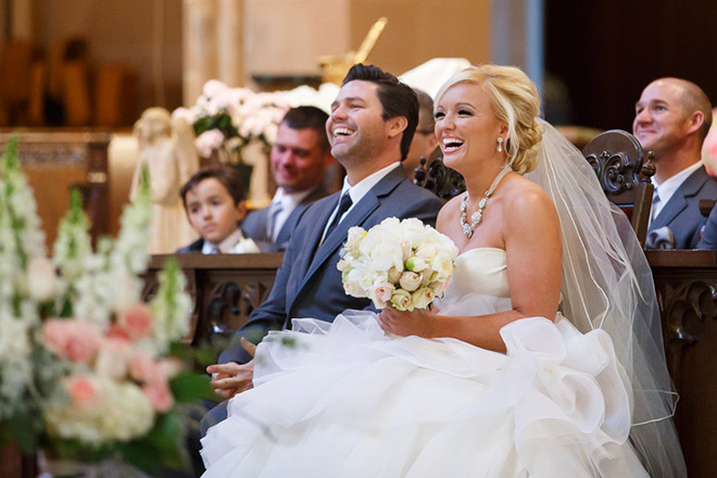 Bride and groom laughing during their wedding ceremony