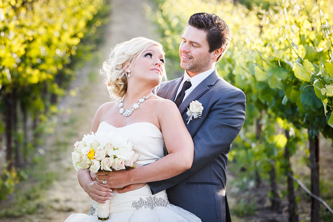 Bride and groom standing in Sonoma vineyard wedding